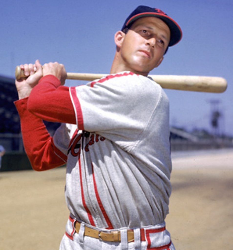 Stan Musial follows through after a practice swing.